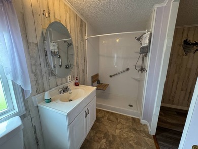 This immaculate, well-maintained 2 bedroom/2 bath manufactured on Lake Henry Golf Club in Florida - for sale on GolfHomes.com, golf home, golf lot