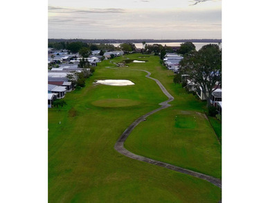 This immaculate, well-maintained 2 bedroom/2 bath manufactured on Lake Henry Golf Club in Florida - for sale on GolfHomes.com, golf home, golf lot