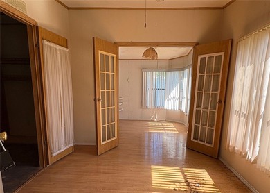 This home sits on a well manicured lot, with a wide driveway on Plantation Golf Club in Florida - for sale on GolfHomes.com, golf home, golf lot