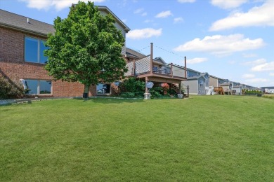 Welcome to this beautifully designed all-brick zero-lot home on The Legends of Champaign in Illinois - for sale on GolfHomes.com, golf home, golf lot