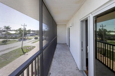 Top-floor unit wth peaceful river to golf course views from the on Beachview Golf Club in Florida - for sale on GolfHomes.com, golf home, golf lot