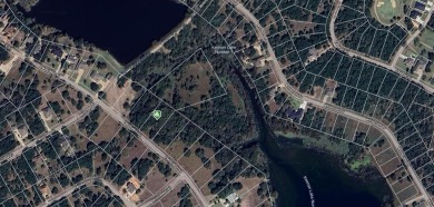 A beautiful 0.75 acre lot nestled between two private lakes on White Bluff Resort - Old Course in Texas - for sale on GolfHomes.com, golf home, golf lot