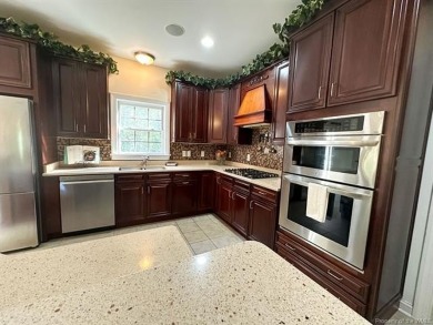 Step into timeless elegance with this one-owner, custom-built on Brickshire Golf Club in Virginia - for sale on GolfHomes.com, golf home, golf lot