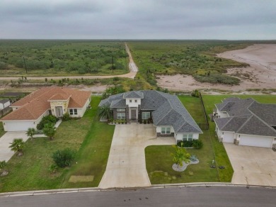 This exquisite custom-built home offers 4 bedrooms, 3 full baths on South Padre Island Golf Club in Texas - for sale on GolfHomes.com, golf home, golf lot