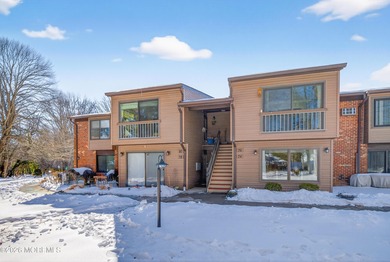 Quiet, private second-floor Navesink model set among the trees on Shadow Lake Village in New Jersey - for sale on GolfHomes.com, golf home, golf lot