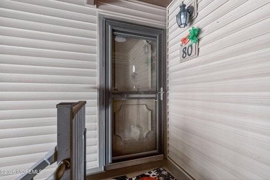 Quiet, private second-floor Navesink model set among the trees on Shadow Lake Village in New Jersey - for sale on GolfHomes.com, golf home, golf lot