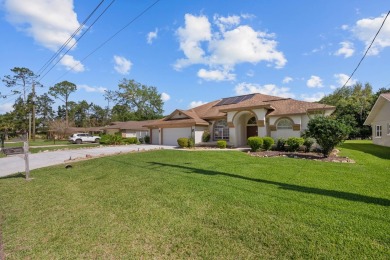 Introducing A Stunning Pool Home In Palm Coast! This Spacious on The Grand Club - Pine Lakes Course in Florida - for sale on GolfHomes.com, golf home, golf lot