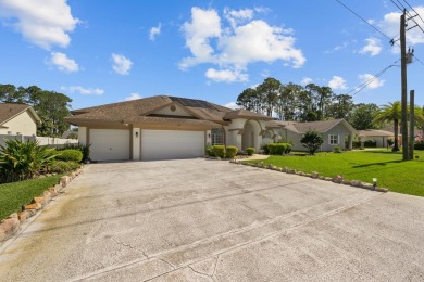 Introducing A Stunning Pool Home In Palm Coast! This Spacious on The Grand Club - Pine Lakes Course in Florida - for sale on GolfHomes.com, golf home, golf lot
