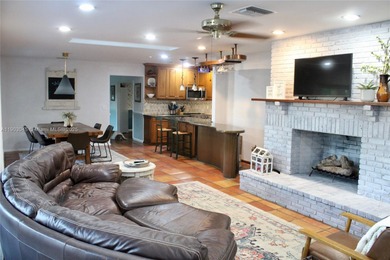 Experience Waterfront Living with this 5-bed, 4-bath Pool Home on Jacaranda Golf Club in Florida - for sale on GolfHomes.com, golf home, golf lot