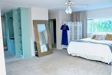 Experience Waterfront Living with this 5-bed, 4-bath Pool Home on Jacaranda Golf Club in Florida - for sale on GolfHomes.com, golf home, golf lot