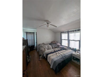 Nestled on a quiet, well-manicured street in the charming town on Normandie Golf Club in Missouri - for sale on GolfHomes.com, golf home, golf lot