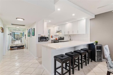 Welcome HOME to this updated corner unit with an open-concept on Palm-Aire Country Club and Resort - The Oaks in Florida - for sale on GolfHomes.com, golf home, golf lot