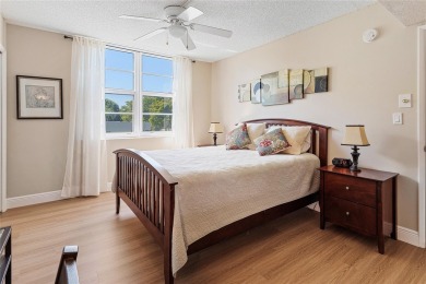 Welcome HOME to this updated corner unit with an open-concept on Palm-Aire Country Club and Resort - The Oaks in Florida - for sale on GolfHomes.com, golf home, golf lot