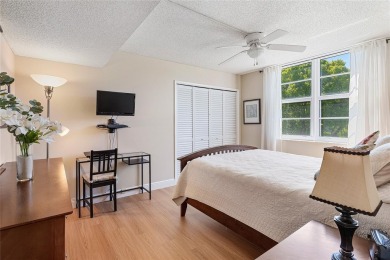 Welcome HOME to this updated corner unit with an open-concept on Palm-Aire Country Club and Resort - The Oaks in Florida - for sale on GolfHomes.com, golf home, golf lot