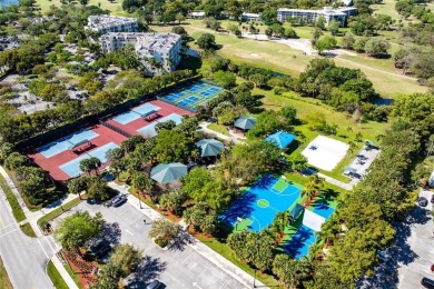 Welcome HOME to this updated corner unit with an open-concept on Palm-Aire Country Club and Resort - The Oaks in Florida - for sale on GolfHomes.com, golf home, golf lot