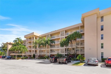 Welcome HOME to this updated corner unit with an open-concept on Palm-Aire Country Club and Resort - The Oaks in Florida - for sale on GolfHomes.com, golf home, golf lot
