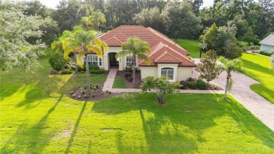 Tucked away on a spacious private lot in the guard gated on Lake Jovita Golf and Country Club in Florida - for sale on GolfHomes.com, golf home, golf lot