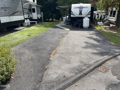 Nice RV lot with plenty of trees, nice patio, and firepit area on Bent Creek Golf Course in Tennessee - for sale on GolfHomes.com, golf home, golf lot