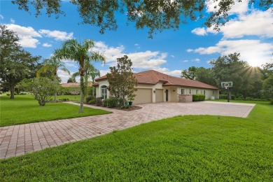 Tucked away on a spacious private lot in the guard gated on Lake Jovita Golf and Country Club in Florida - for sale on GolfHomes.com, golf home, golf lot