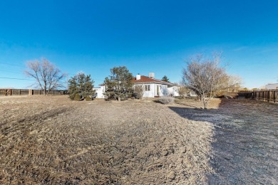 Welcome to this incredible custom home, nestled on a full-acre on Santa Fe Country Club in New Mexico - for sale on GolfHomes.com, golf home, golf lot