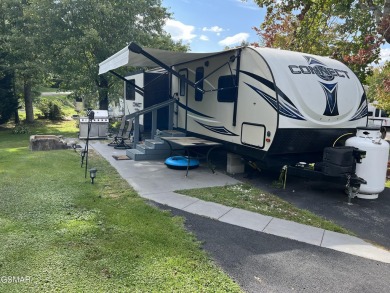 Nice RV lot with plenty of trees, nice patio, and firepit area on Bent Creek Golf Course in Tennessee - for sale on GolfHomes.com, golf home, golf lot