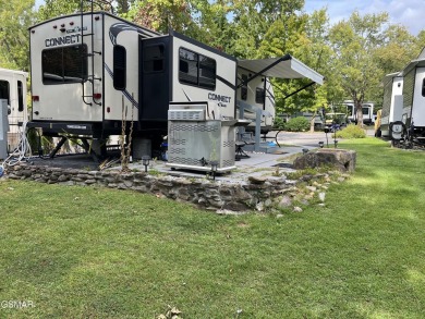 Nice RV lot with plenty of trees, nice patio, and firepit area on Bent Creek Golf Course in Tennessee - for sale on GolfHomes.com, golf home, golf lot
