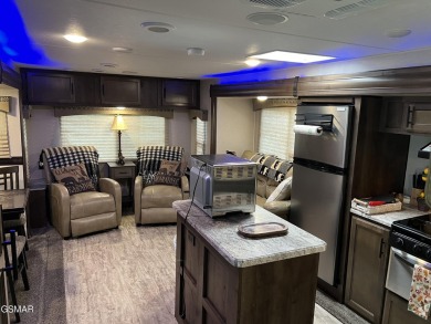 Nice RV lot with plenty of trees, nice patio, and firepit area on Bent Creek Golf Course in Tennessee - for sale on GolfHomes.com, golf home, golf lot
