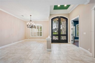 Tucked away on a spacious private lot in the guard gated on Lake Jovita Golf and Country Club in Florida - for sale on GolfHomes.com, golf home, golf lot