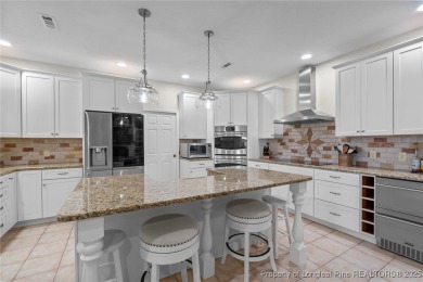 Discover this stunning home on a lakefront lot in the on Woodlake Country Club in North Carolina - for sale on GolfHomes.com, golf home, golf lot