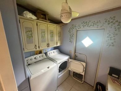 This well-loved 2-bedroom, 2-bathroom Palm Harbor home is being on Del Tura Golf and Country Club in Florida - for sale on GolfHomes.com, golf home, golf lot