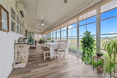 Discover this stunning home on a lakefront lot in the on Woodlake Country Club in North Carolina - for sale on GolfHomes.com, golf home, golf lot