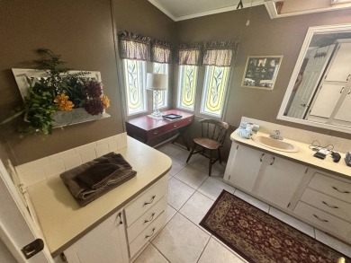 This well-loved 2-bedroom, 2-bathroom Palm Harbor home is being on Del Tura Golf and Country Club in Florida - for sale on GolfHomes.com, golf home, golf lot