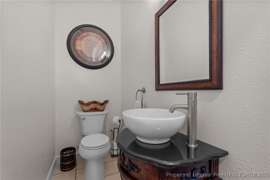 Discover this stunning home on a lakefront lot in the on Woodlake Country Club in North Carolina - for sale on GolfHomes.com, golf home, golf lot