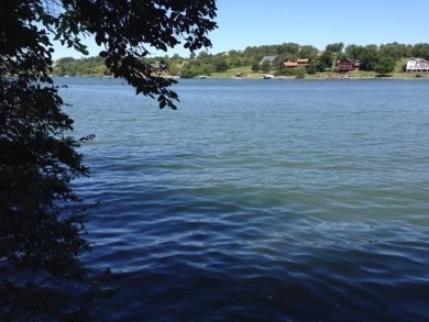 Beautiful 1.9-acre wooded waterfront lot on the main body of on Lake Carroll Golf Course in Illinois - for sale on GolfHomes.com, golf home, golf lot