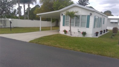 This adorable park model is conveniently located at the front of on Lily Lake Golf and RV Resort in Florida - for sale on GolfHomes.com, golf home, golf lot
