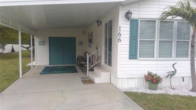 This adorable park model is conveniently located at the front of on Lily Lake Golf and RV Resort in Florida - for sale on GolfHomes.com, golf home, golf lot