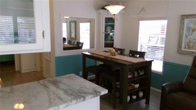 This adorable park model is conveniently located at the front of on Lily Lake Golf and RV Resort in Florida - for sale on GolfHomes.com, golf home, golf lot