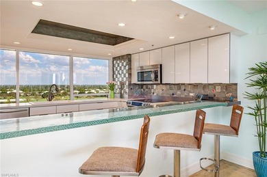 Imagine living amidst the colors of the sea in this on Club at Pelican Bay Golf Course in Florida - for sale on GolfHomes.com, golf home, golf lot
