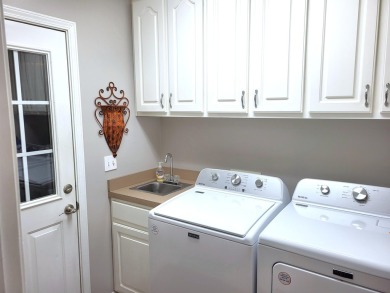 Exceptionally maintained brick home in the Wyboo Plantation on Players Course At Wyboo Plantation in South Carolina - for sale on GolfHomes.com, golf home, golf lot