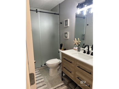 Coastal charm meets comfort in this move-in ready 3-bedroom on Orange Beach Golf Center in Alabama - for sale on GolfHomes.com, golf home, golf lot