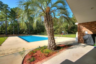 Exceptionally maintained brick home in the Wyboo Plantation on Players Course At Wyboo Plantation in South Carolina - for sale on GolfHomes.com, golf home, golf lot