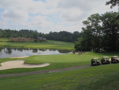 This beautiful lot overlooks the lake and 13th green on the on The Clubs of Olde Mill in Virginia - for sale on GolfHomes.com, golf home, golf lot