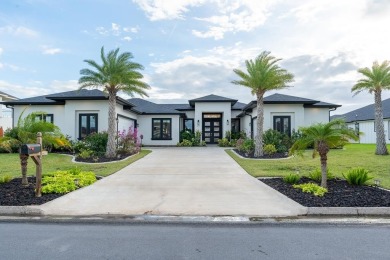 Discover your dream home at 29 Whooping Crane, a stunning on South Padre Island Golf Club in Texas - for sale on GolfHomes.com, golf home, golf lot