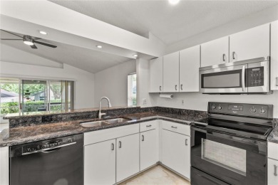 This Oxford Model Features 2 Bedrooms, 2 Baths, Den and a on Kings Ridge Golf Club in Florida - for sale on GolfHomes.com, golf home, golf lot