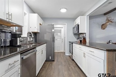 Welcome to this adorable, move-in-ready home on a large lot in on Hide-A-Way Lake Golf Course in Texas - for sale on GolfHomes.com, golf home, golf lot