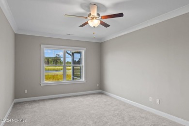 Welcome to 203 Windswept Lane, where modern living meets comfort on North River Club in North Carolina - for sale on GolfHomes.com, golf home, golf lot