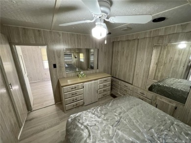 Step into coastal comfort with this 2 bedroom, 1 bathroom on Island Dunes Country Club in Florida - for sale on GolfHomes.com, golf home, golf lot