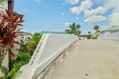 Step into coastal comfort with this 2 bedroom, 1 bathroom on Island Dunes Country Club in Florida - for sale on GolfHomes.com, golf home, golf lot