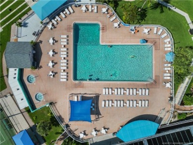 Step into coastal comfort with this 2 bedroom, 1 bathroom on Island Dunes Country Club in Florida - for sale on GolfHomes.com, golf home, golf lot