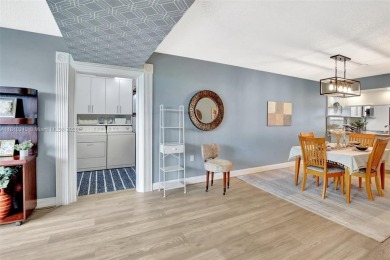 Beautifully updated & artist-decorated 2-bed, 2-bath condo with on Pine Island Ridge Country Club in Florida - for sale on GolfHomes.com, golf home, golf lot